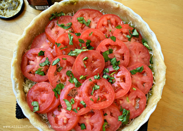 Fresh tomato slices and a generous sprinkle of chopped fresh basil is the generous top layer of these cheeesy tomato tart.