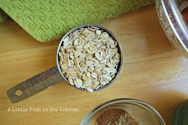 1/2 cup measuring cup filled with old fashioned oats.