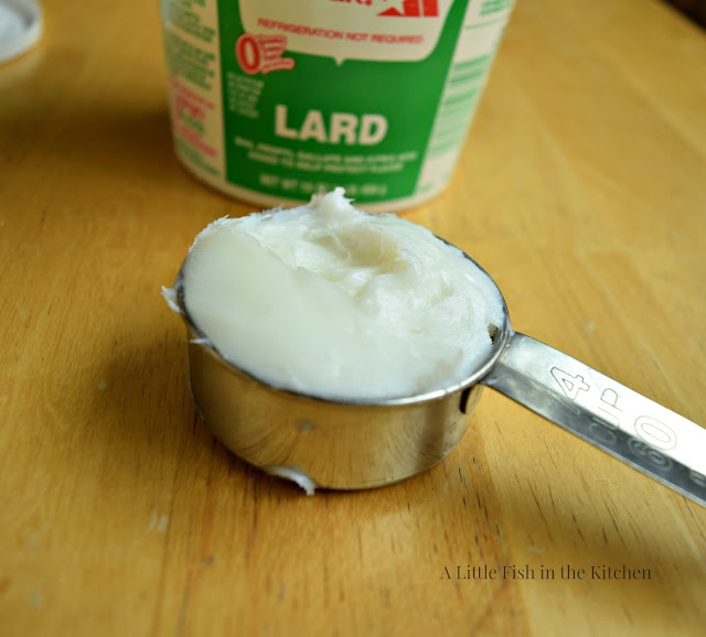 1/4 cup of lard is measured out to make homemade tortillas. 