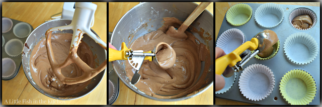 Chocolate cupcake batter is distributed to the lined muffin tin using an ice cream scooper.