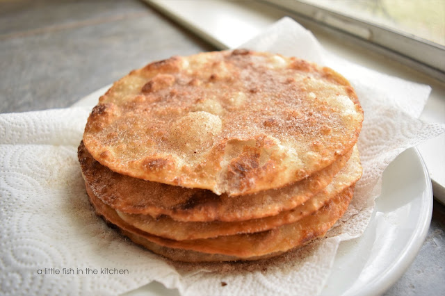 A stack of five perfectly fried cinnamon and sugar tortillas are ready to enjoy. Freshly cooked Mexican buñelos are irresistible.