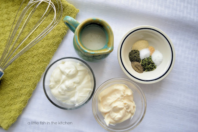 The simple ingredients needed to prepare buttermilk ranch dressing: herbs and spices, sour cream, mayonnaise, and buttermilk. 