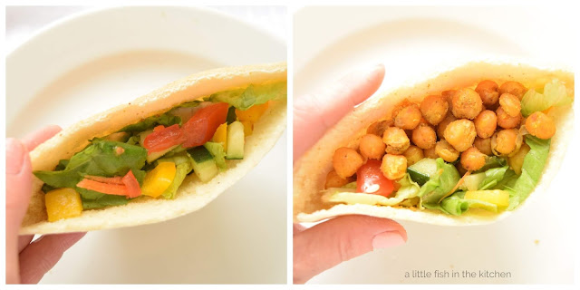 A tender pita pocket is stuffed with a crisp veggie loaded salad and topped with roasted chickpeas.