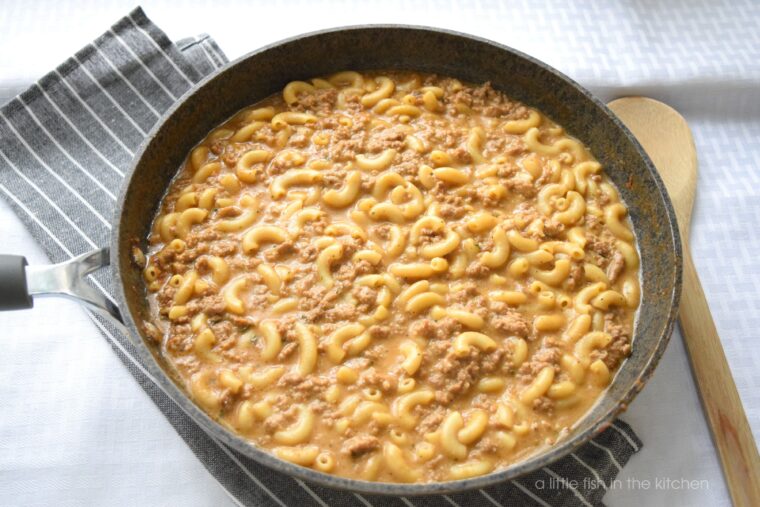 Creamy homemade hamburger helper cheeseburger mac is read to serve straight from the skillet. Tender bits of ground meat, cooked macaroni noodles are nestled in a creamy cheese sauce. 