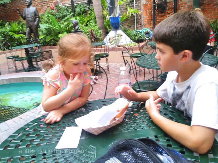 My kids having their first taste of a NOLA beignet at the Music Legends Cafe. 