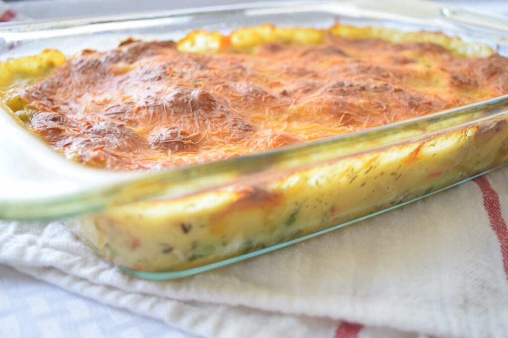 Picture of the side and creamy vegetable filling of a chicken pot pie bubble up casserole.