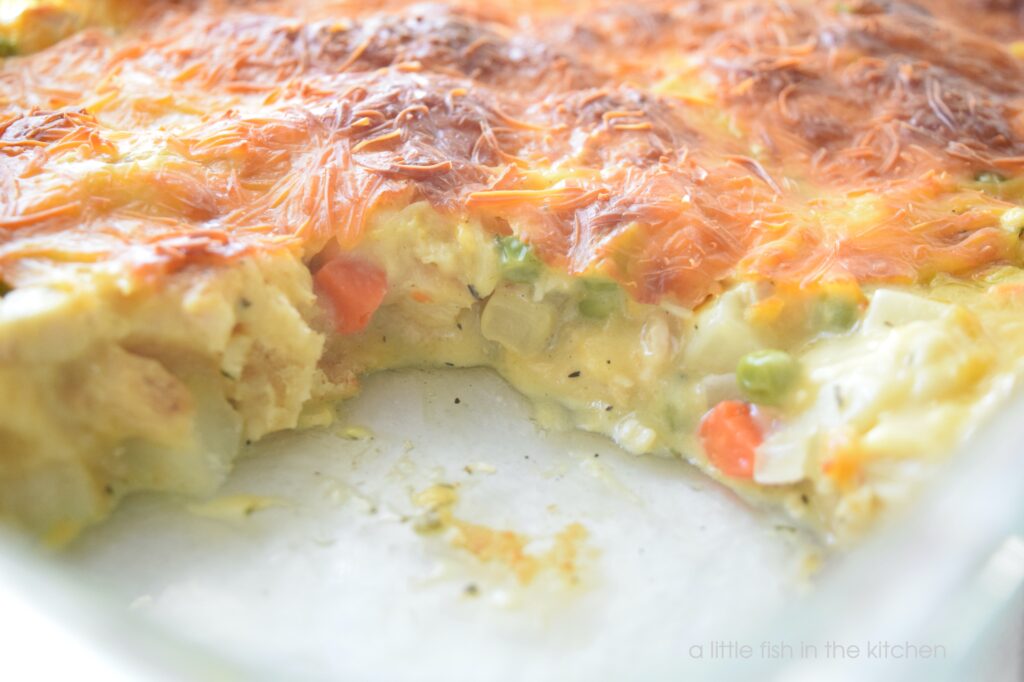 Picture of the inside of a chicken pot pie bubble up casserole with vegetables and creamy soup.