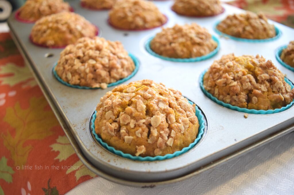 Close up picture of pumpkin oat streusel muffins in a muffin tin 