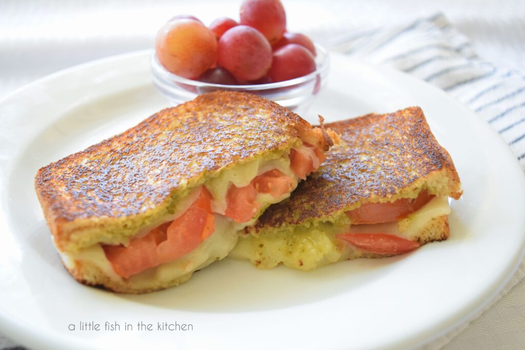 picture of sliced tomato-pesto grilled cheese 