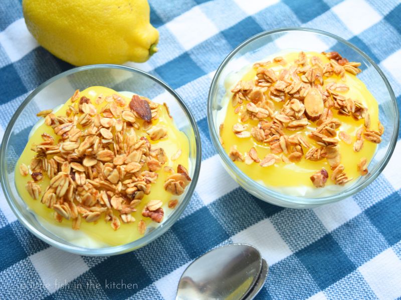 the bright yellow lemon topping is topped with granola. 