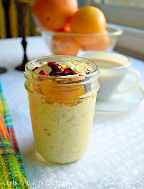 Overnight oats are ready to serve in a clear mason jar. The prepared oats look creamy and inviting in the glass jar.